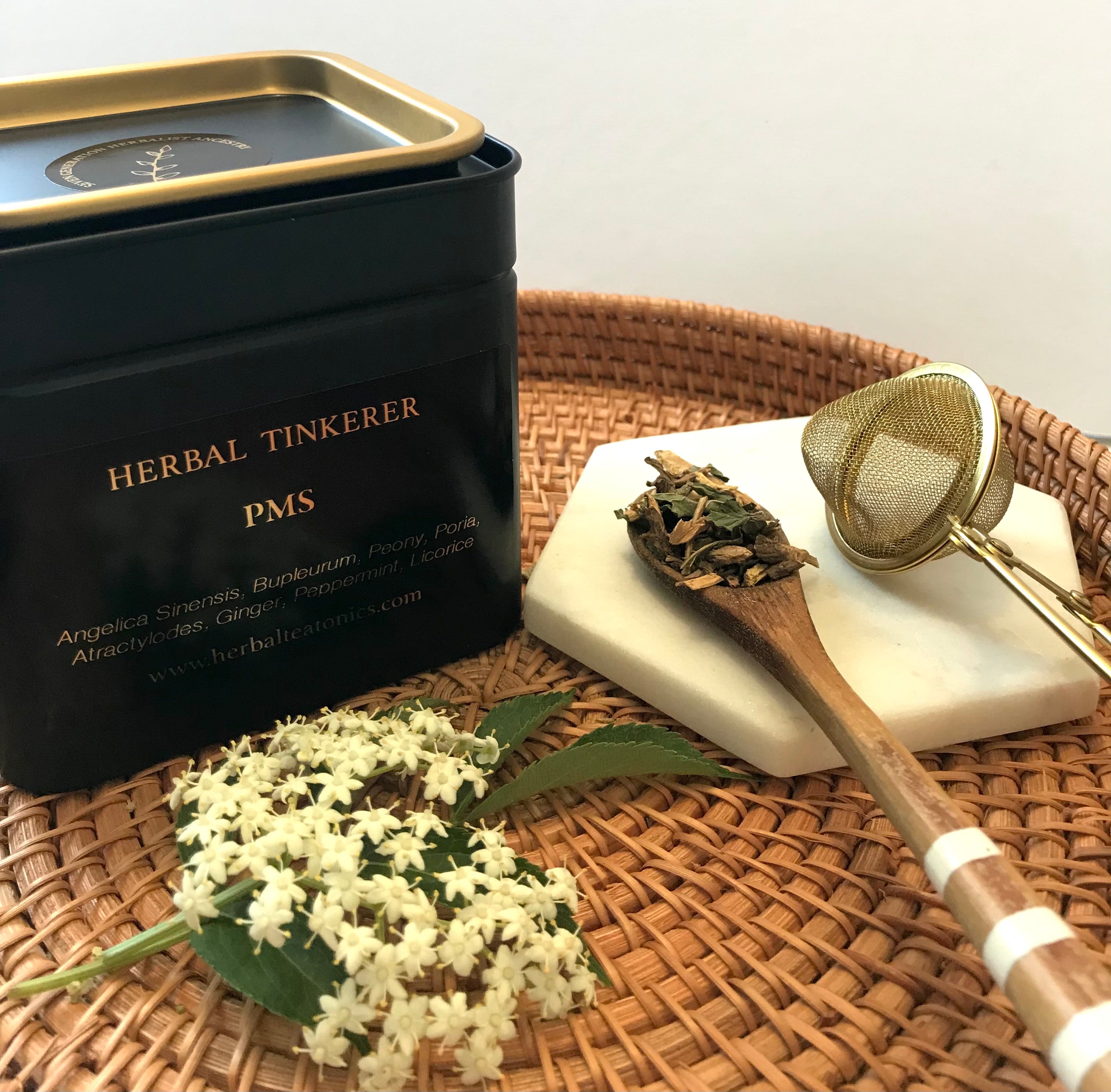 Preparing fresh herbs for a natural herbal tea for PMS support