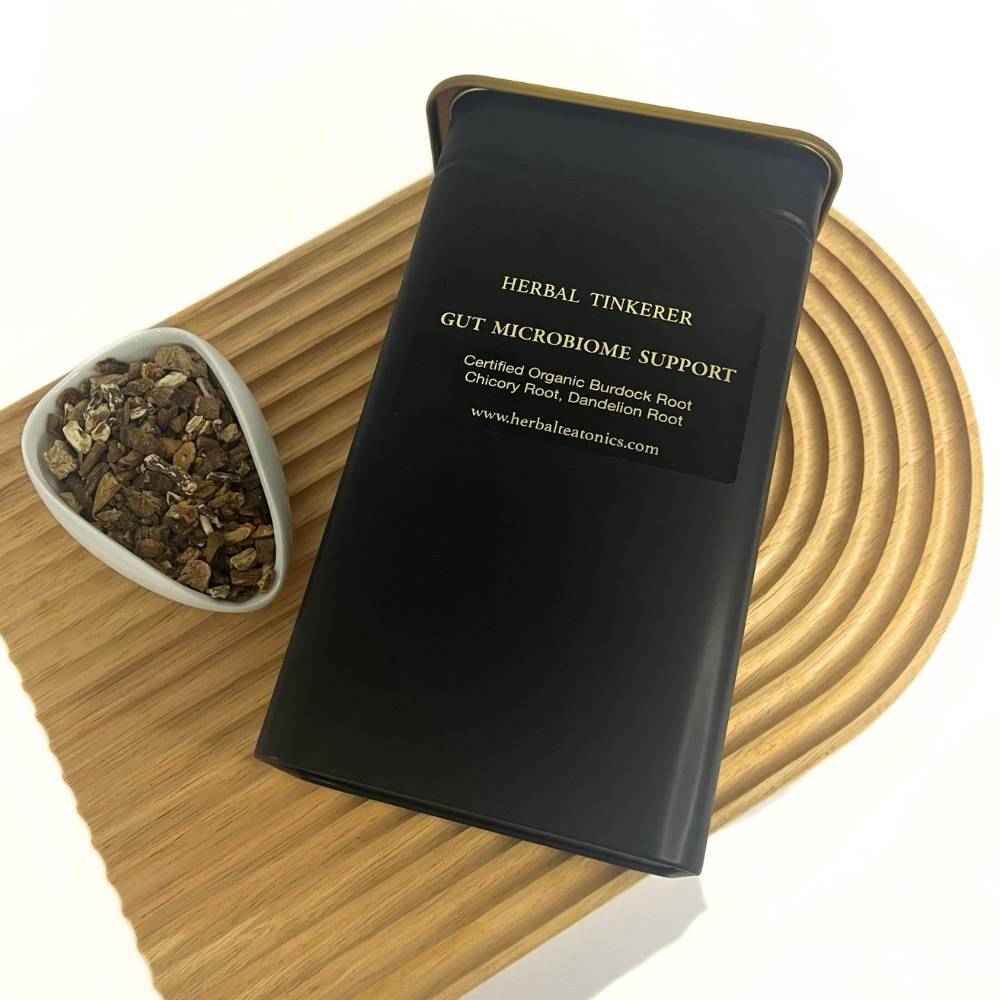Gut microbiome after detox herbal tea blend in a Herbal Tinkerer tea tin with loose organic herbs.