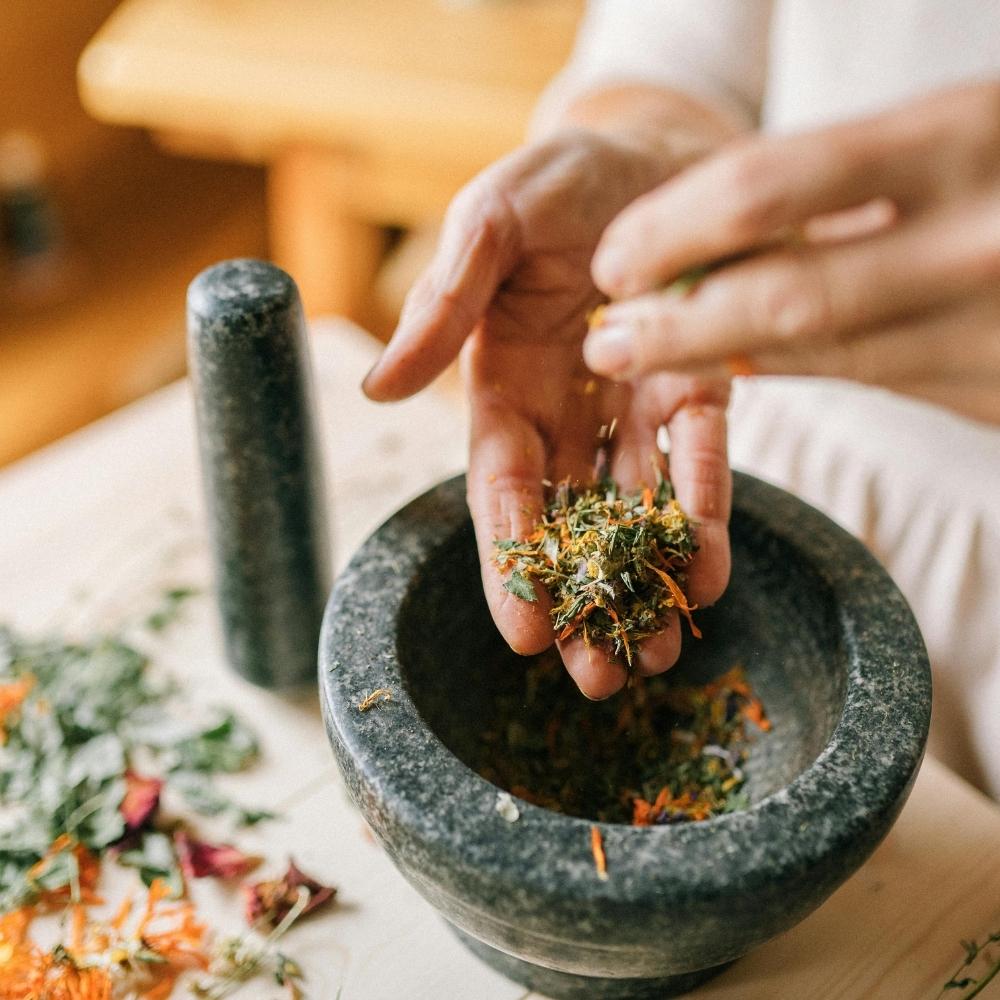 Preparing herbs to support how the body detoxes naturally.
