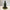 Herbal tincture bottle with pine needles on a marble surface